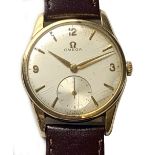 OMEGA; a gentleman's 9ct yellow gold vintage wristwatch, the circular dial set with subsidiary