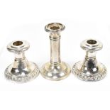 WILLIAM AITKEN; an Edward VII hallmarked silver candlestick, together with a pair of sterling silver