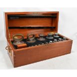 OERTLING; a mahogany cased set of brass standard weights, 500g to 0.001ozt.