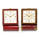 JAEGER; two Art Deco folding travel clocks, each of similar form with Arabic numerals and batons.