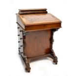 A Victorian walnut, burr walnut and inlaid Davenport with four working and four dummy drawers to