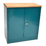 A painted green metal cabinet with MDF top, length 91cm.