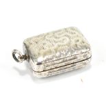 An early 19th century hallmarked silver vinaigrette of rounded rectangular form, with unusual