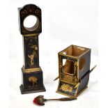 A 19th century black painted and gilt heightened chinoiserie pocket watch holder in the form of a