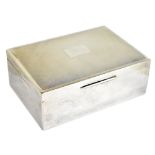 An Elizabeth II hallmarked silver cigarette box of rounded rectangular form, with engraved detail to