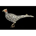 A yellow and white metal diamond set brooch in the form of a pheasant with enamelled detailing