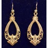 A pair of 9ct yellow gold drop earrings, with pierced decoration, approx 3g.