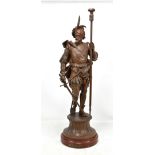 An early 20th century bronzed spelter figural table lamp 'Mephisto', raised on circular plinth base,