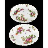 CHELSEA; a large pair of shaped oval bowls painted with fruit, butterflies and insects, painted