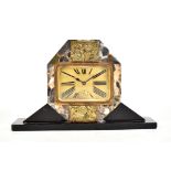 A French Art Deco marble and slate mantel clock, the square dial set with Roman numerals set between