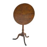 A George III oak tilt top occasional table, diameter 52.5cm.