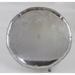 A George V hallmarked silver salver with bead rim and hoof supports, diameter 31cm,