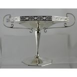 A George V hallmarked silver octagonal twin-handled shallow bowl on tapering column supports to