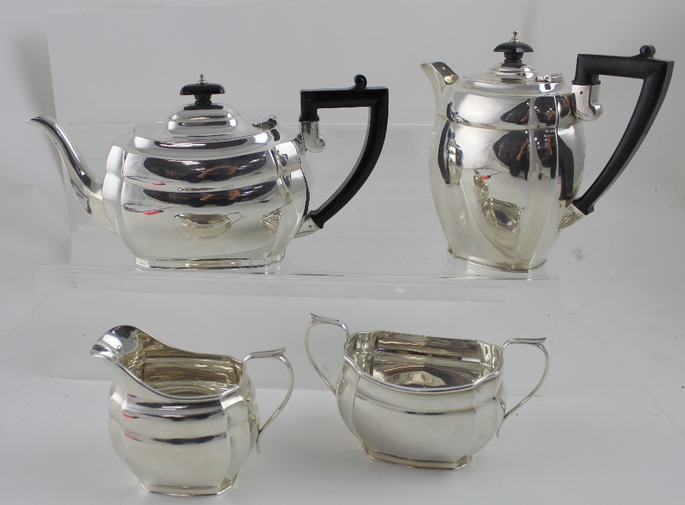 A George VI hallmarked silver four-piece tea set comprising teapot, length 27cm, hot water pot,