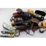 A mixed group of cameras and binoculars including Olympus OM-10, Balda,