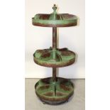 A reproduction metal three-tier garden planter, with three circular rotating sections,