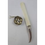 A Russian hallmarked silver tea strainer and an ivory page turner with white metal handle in the