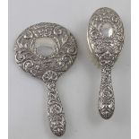 An Elizabeth II hallmarked silver two-piece vanity set, hand mirror and hair brush, Broadway & Co,