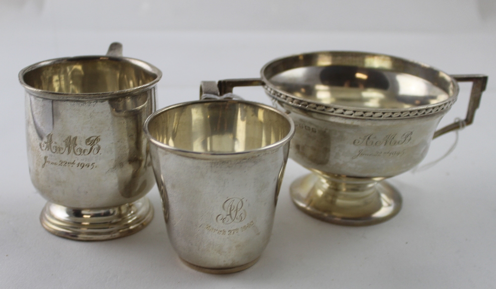 A George VI hallmarked silver twin-handled Art Deco bowl on circular foot, engraved 'A.M.