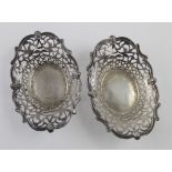 An Edward VII hallmarked silver oval bonbon dish with pierced decoration inside a cast rim,