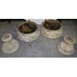 A pair of composite circular garden planters on a spreading circular stand (2).