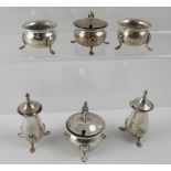 Two matching George VI hallmarked silver cruets, two pepper pots, two salts and two mustard pots,