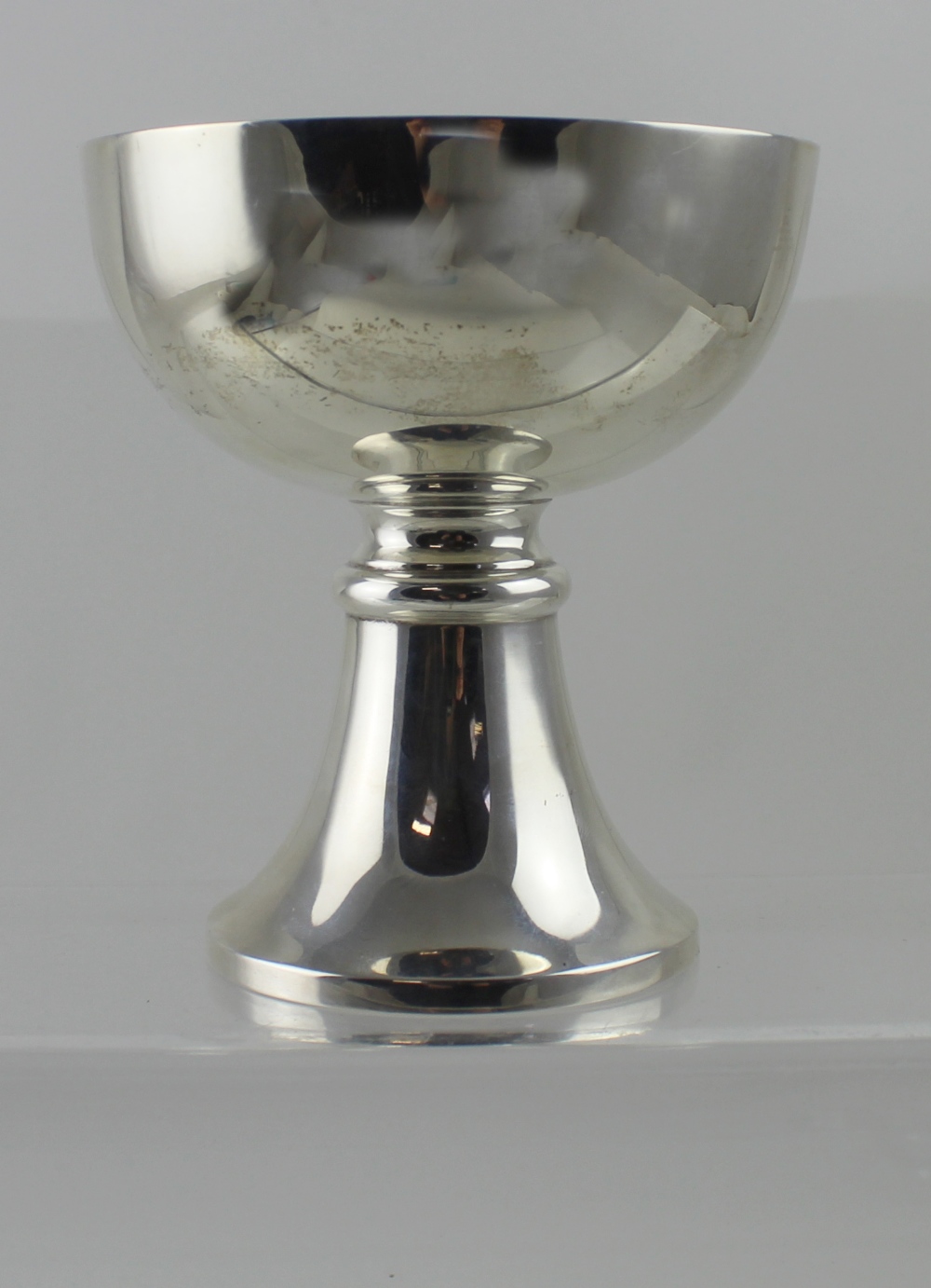 A George V hallmarked silver cup on circular spreading base, E.S.