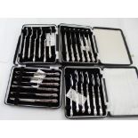 Four Elizabeth II hallmarked silver-handled matching cased sets of pastry knives and forks,