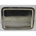 A George V hallmarked silver engine turned rectangular tray with chased fleur-de-lys decoration, J,