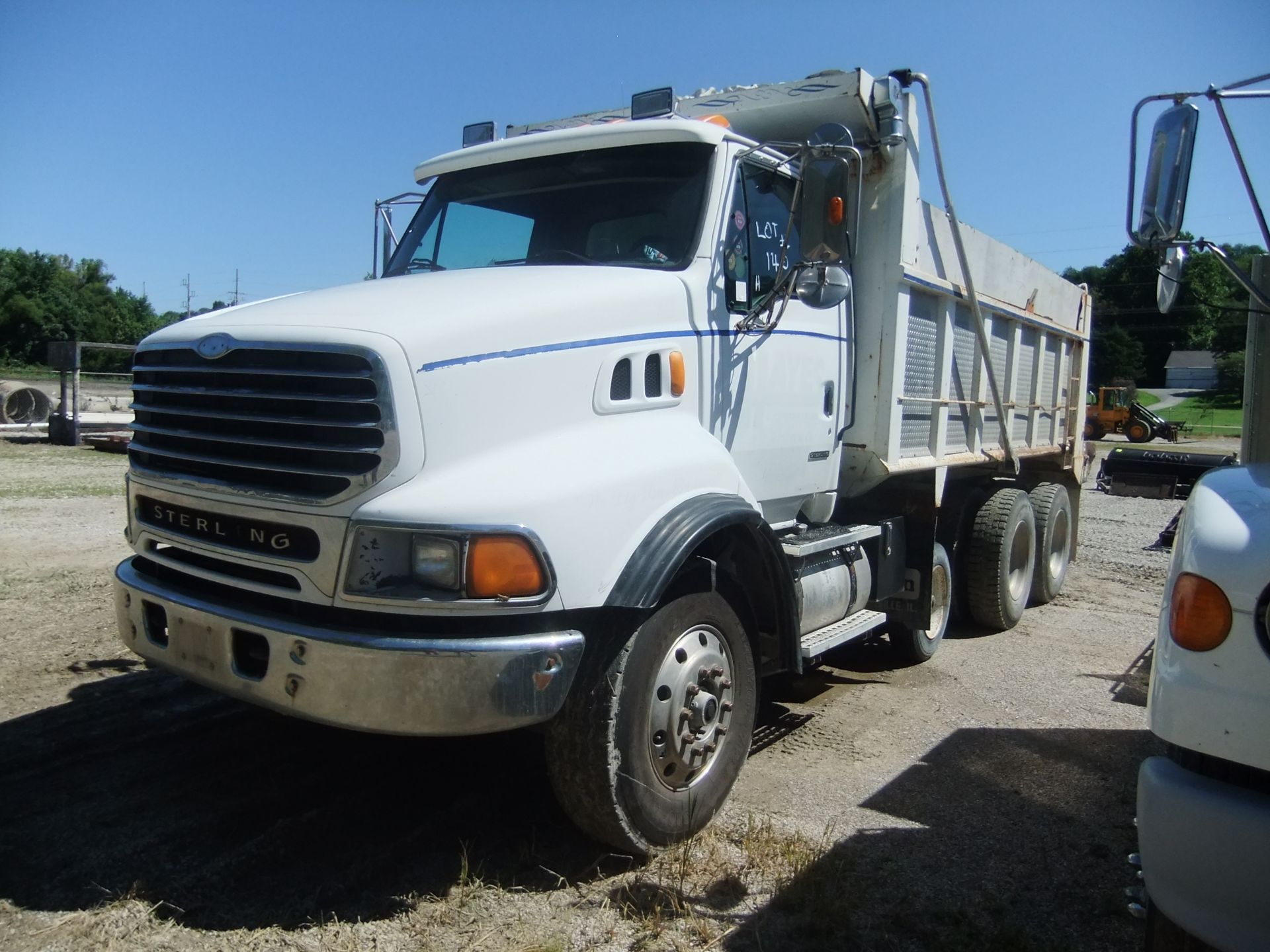 2001 STERLING DUMP TRUCK. CATERPILLAR 6 CYL DIESEL.