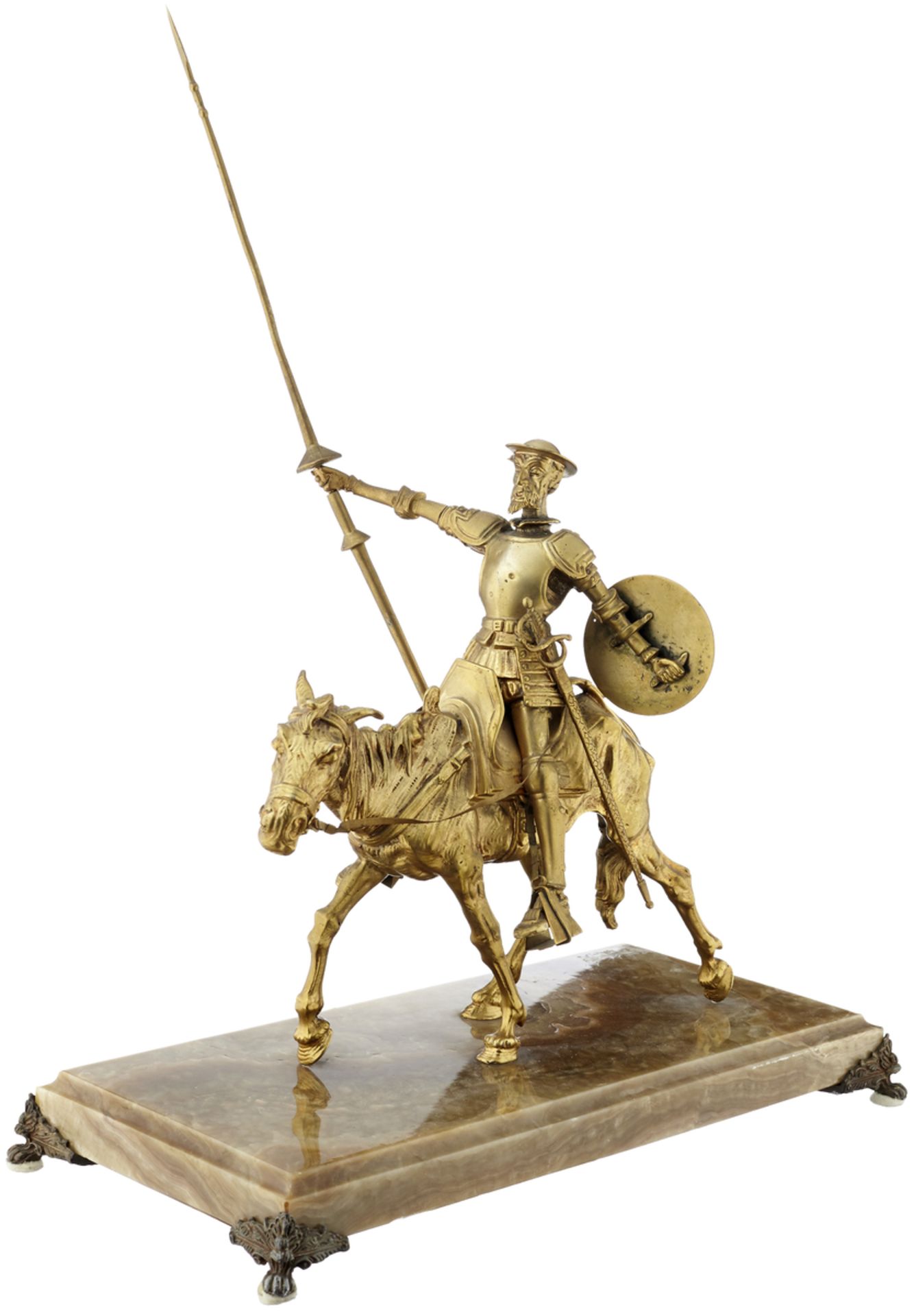 Don QuijoteAnfang 20. Jh. "Don Quijote zu Pferd". Bronze vergoldet. Unsigniert. Sockel aus beige