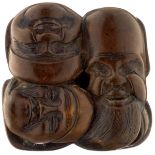 Netsuke MaskengruppeJapan 19. Jh. Helles Holz. Die Masken der sieben Glücksgötter. Signiert.