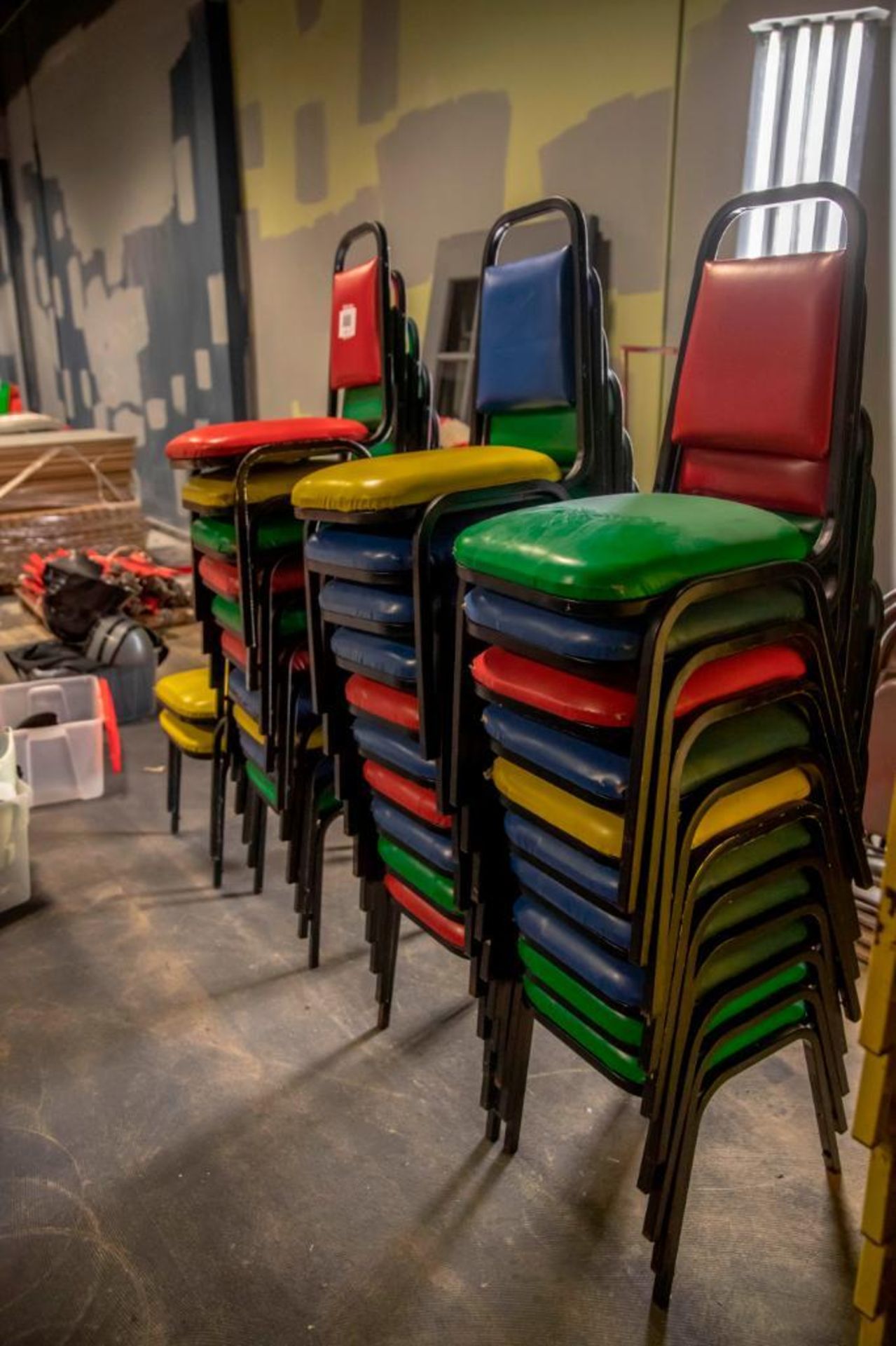 32 vinyl chairs, mixed colours. Used, shows commercial use. See pictures.