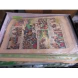 Box of old paper cuttings and comics