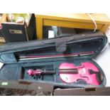 Pink student violin with bow and case