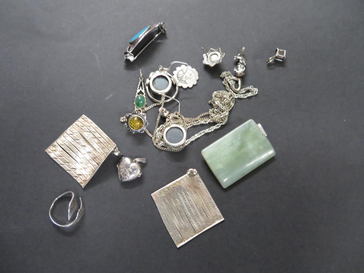 Collection of silver jewellery and jade pendants