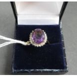 Vintage 18ct gold ring set with a 10carat Siberian amethyst surrounded by 24 natural cut brilliant