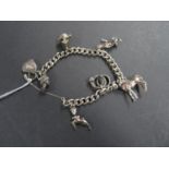 Silver charm bracelet 42.6 grams