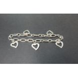 Silver charm bracelet with heart appendages. 12 grams