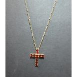 9ct gold garnet set cross and chain. 2.5g