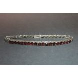 Lovely silver bracelet set with garnet stones