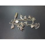 Vintage silver charm bracelet with some rare charms including a revolver & Noahs ark. Birmingham1973