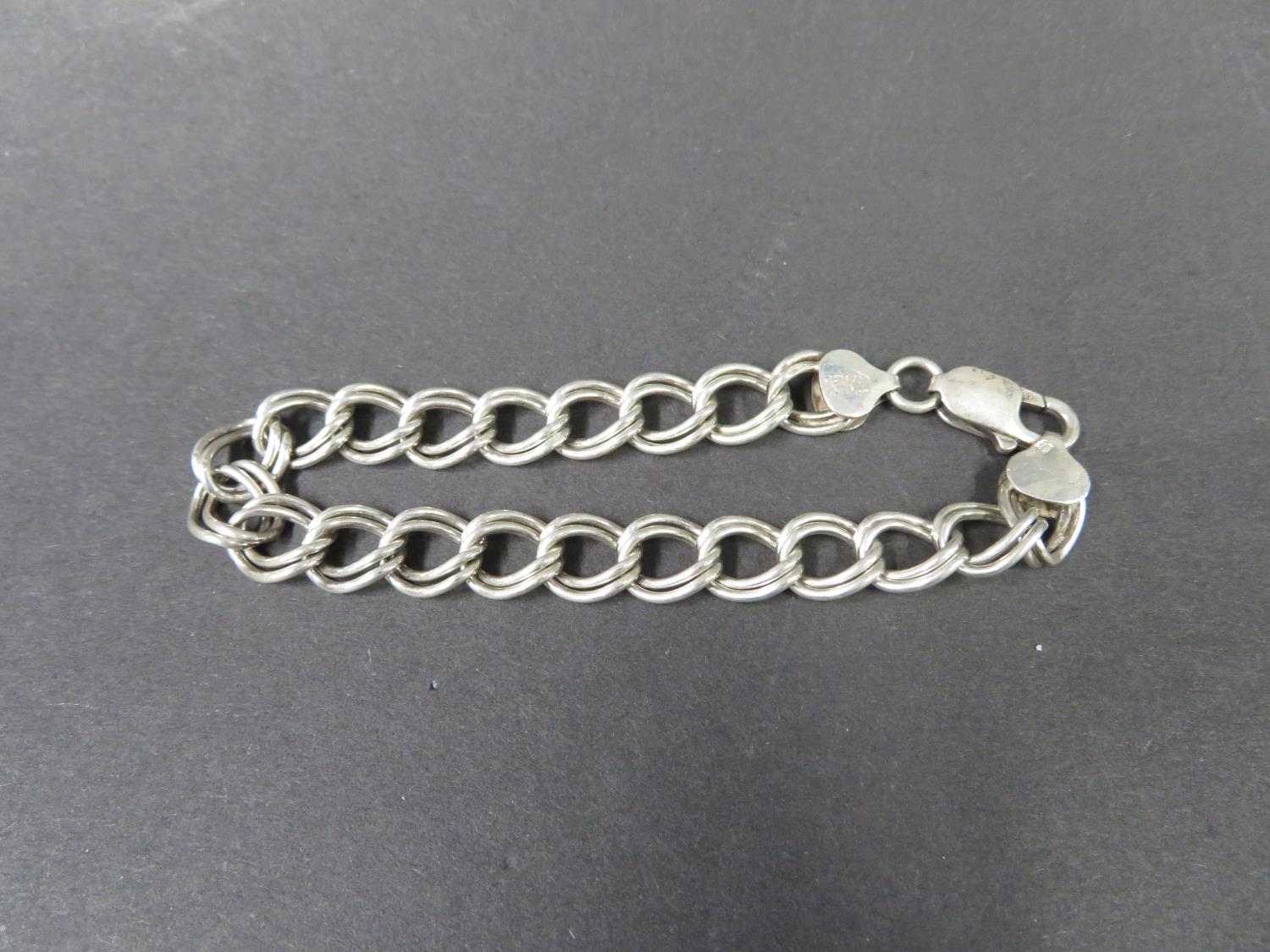 Lady's silver double link curb bracelet. Fully hallmarked. Weight 7g