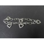 Silver bracelet with heart appendages stamped '925'. weight 13g