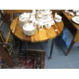 Heavy round wooden table with metal legs