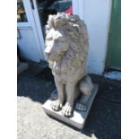 Pair of large lions in cast concrete