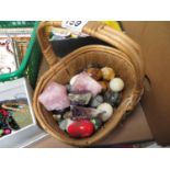 Marble eggs and crystals in basket