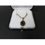 Vintage gold on silver pendant set with garnets on a silver gilt chain. Weight 5g