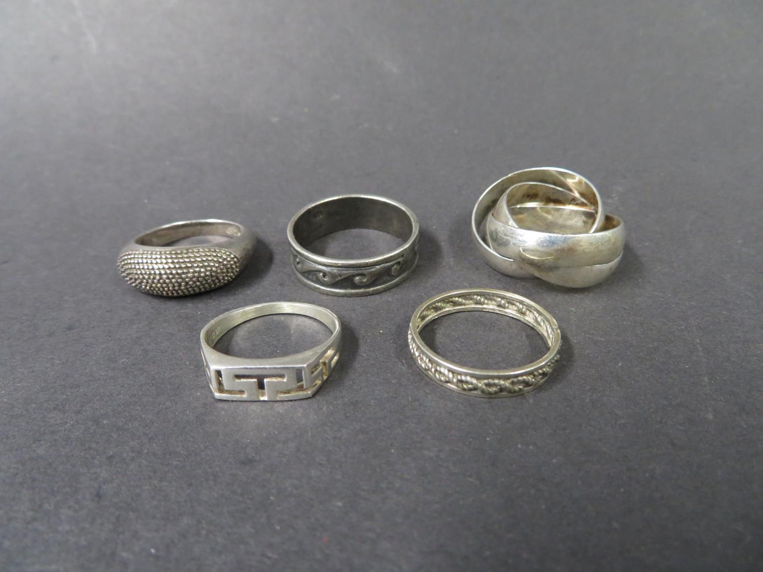 Russian wedding ring and 4 other rings. All silver. Weight 20g