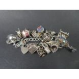 Vintage silver charm bracelet by Georg Jensen, Fully hallmarked London 1974 with 20 nice charms.